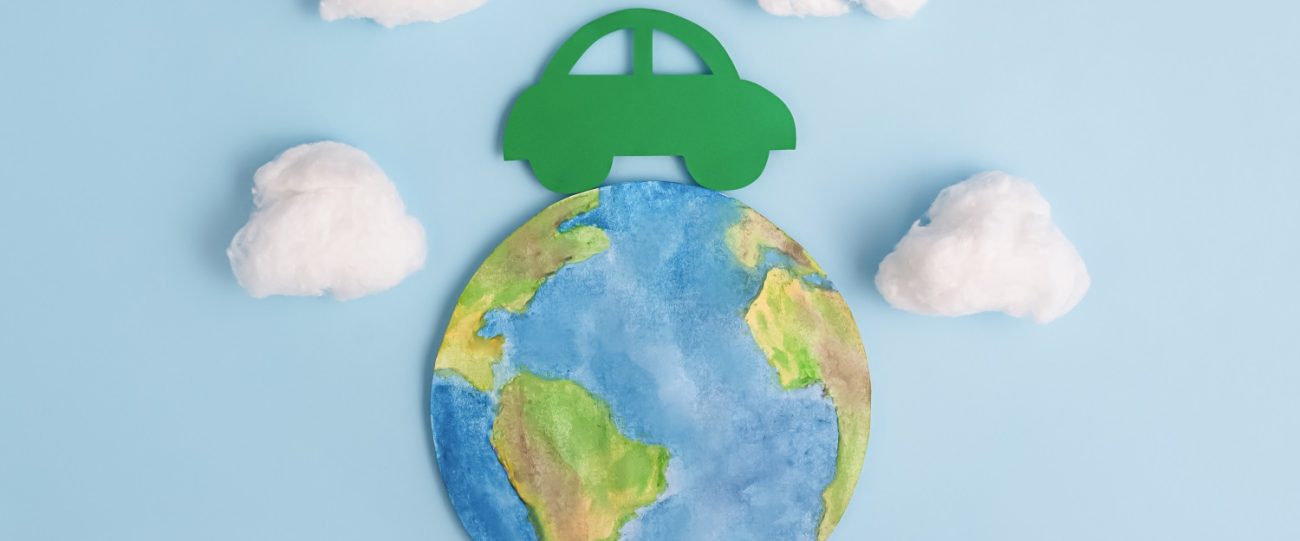 Green car and planet earth. Ecological transport. Ecology concept.