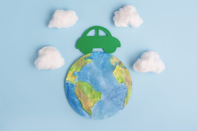 Green car and planet earth. Ecological transport. Ecology concept.