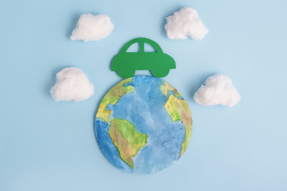 Green car and planet earth. Ecological transport. Ecology concept.