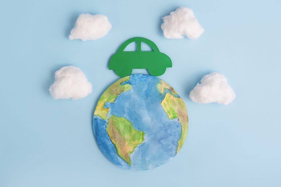 Green car and planet earth. Ecological transport. Ecology concept.