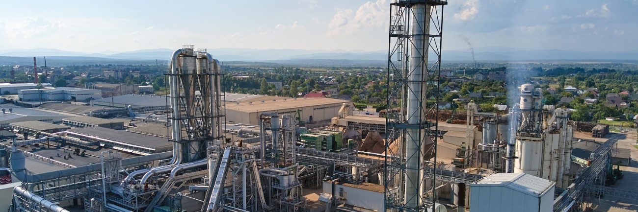 Aerial view of oil and gas refining petrochemical factory with tall refinery plant manufacture structure. Aerial view of oil and gas refining petrochemical factory with tall refinery plant manufacture structure.