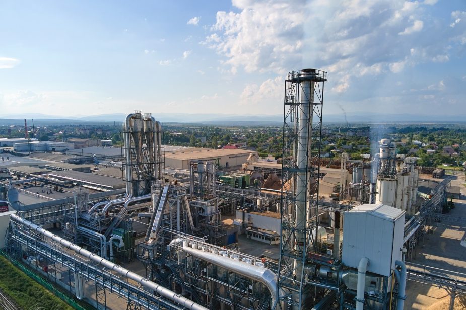 Aerial view of oil and gas refining petrochemical factory with tall refinery plant manufacture structure. Aerial view of oil and gas refining petrochemical factory with tall refinery plant manufacture structure.