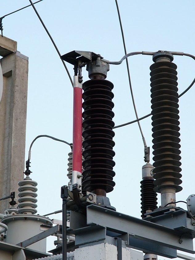 Power transformer. Electrical equipment. Electric substation. High voltage transformer against the blue sky. Electric current redistribution substation Power transformer. Electrical equipment. Electric substation. High voltage transformer against the blue sky. Electric current redistribution substation