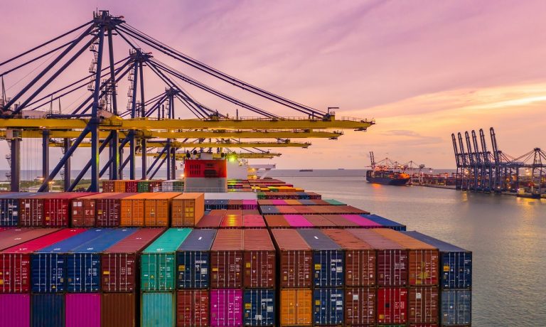 Container ship loading and unloading in deep sea port at sunset, Container ship loading and unloading in deep sea port at sunset,