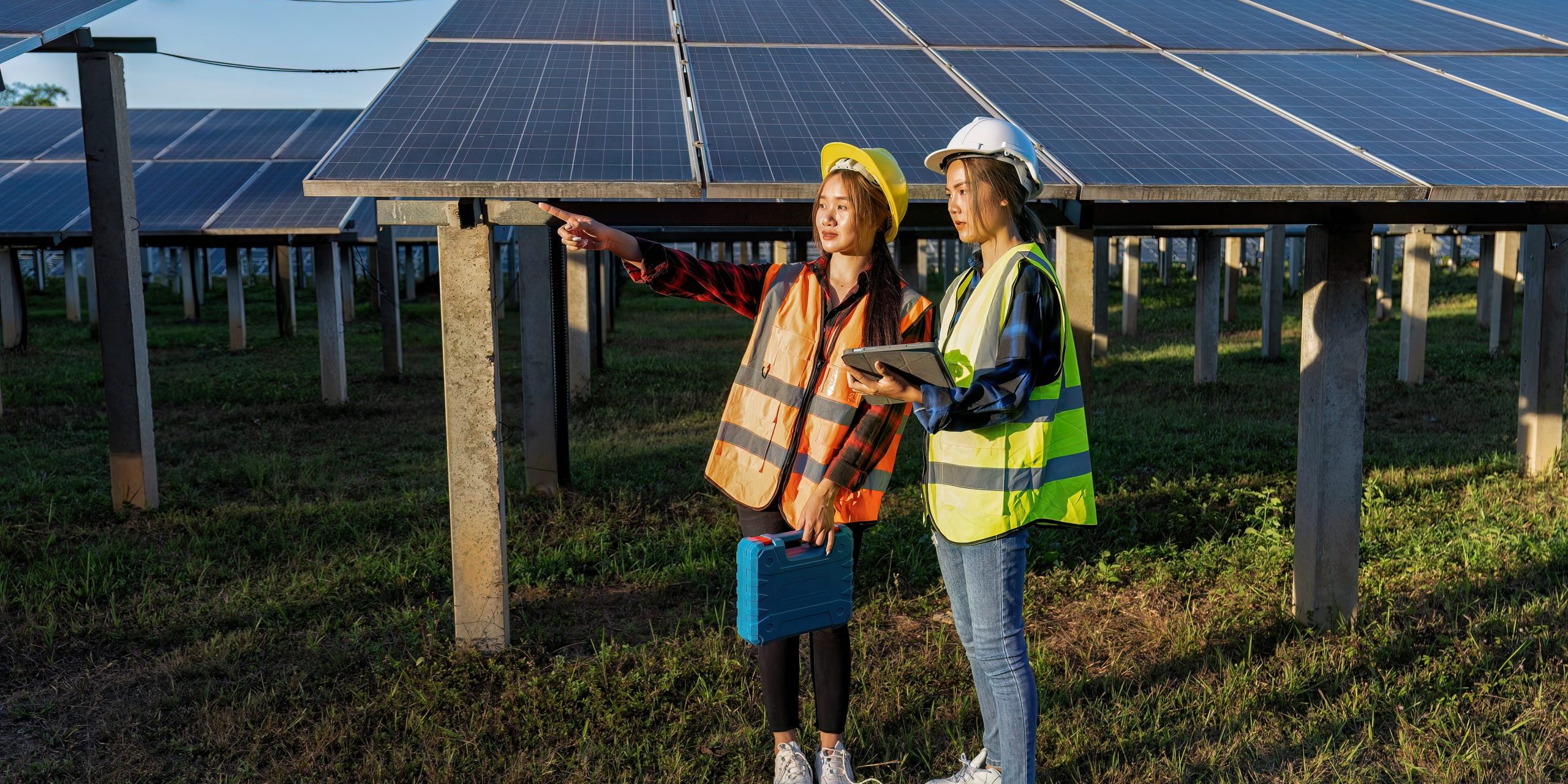 2 maintenance girl engineer carry tool box routine maintenance at greenery solar farm in village