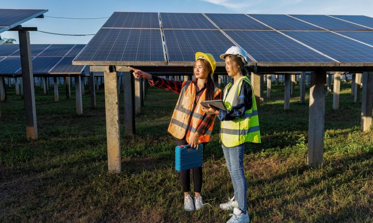 2 maintenance girl engineer carry tool box routine maintenance at greenery solar farm in village