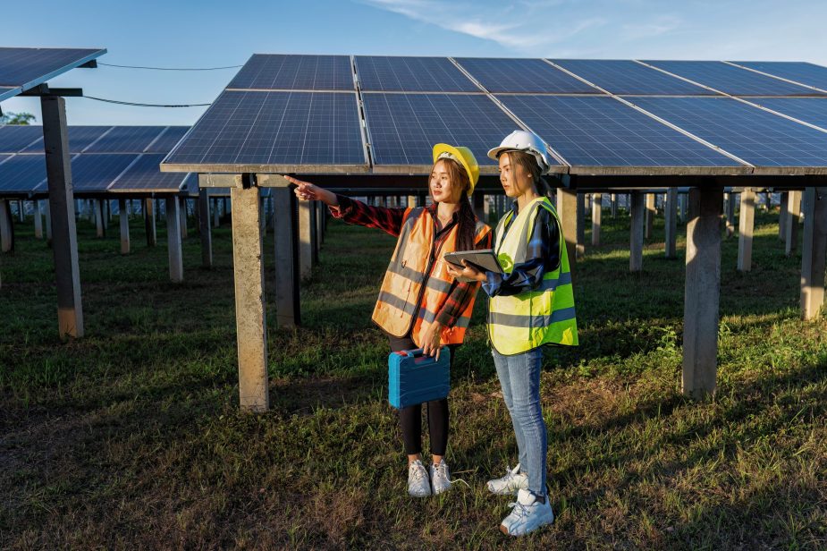 2 maintenance girl engineer carry tool box routine maintenance at greenery solar farm in village