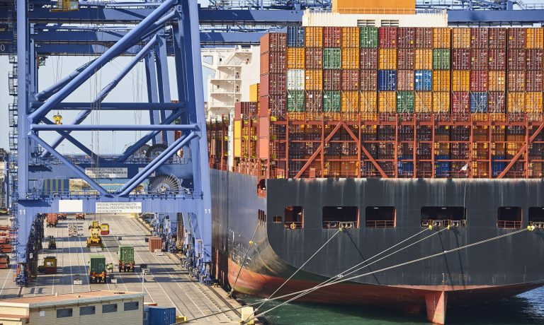 Containers on a vessel. Global market. Cargo shipping. Logistic