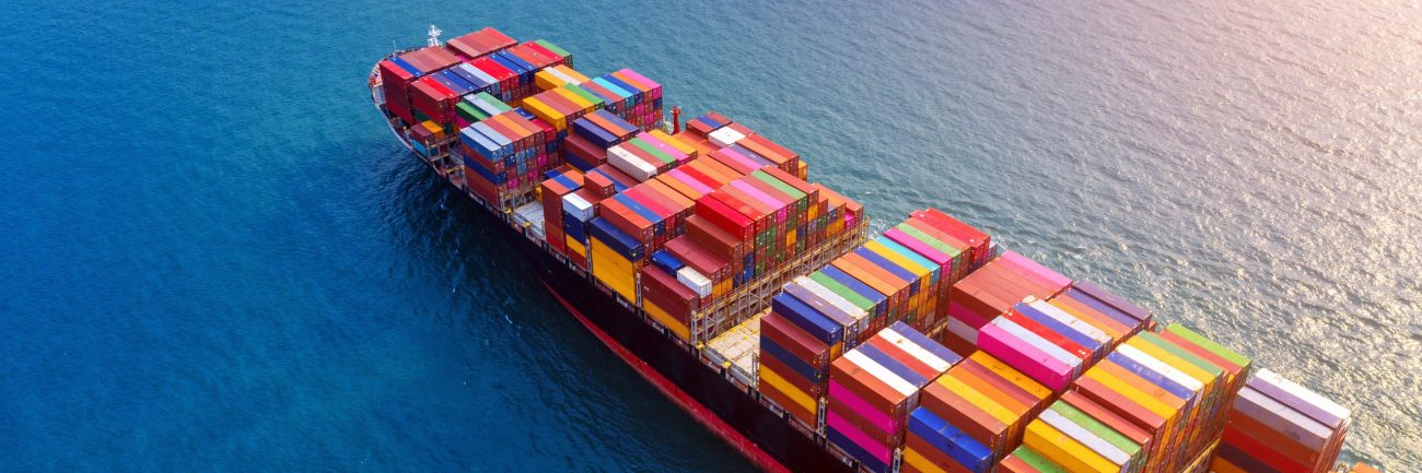 Aerial view of container cargo ship in sea.