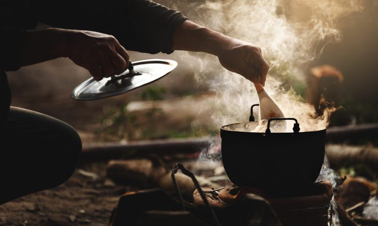 Beautiful silhouette the cook rice with flare lighting and steam