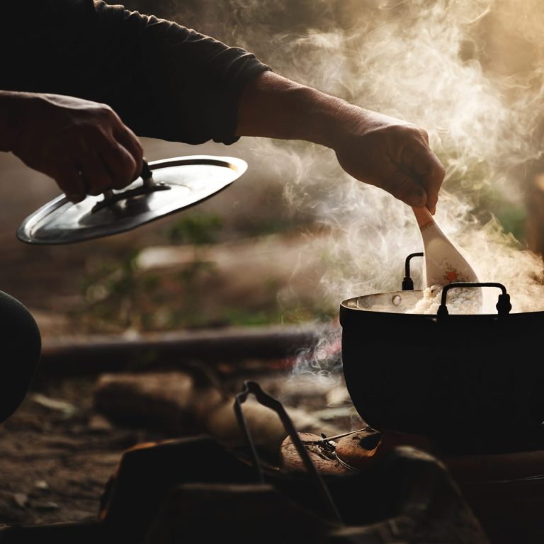 Beautiful silhouette the cook rice with flare lighting and steam