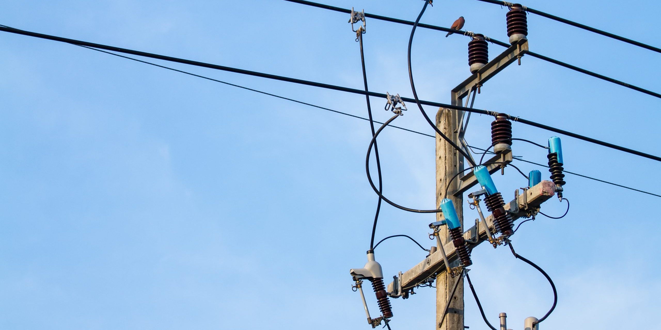 electric pole power with blue sky background