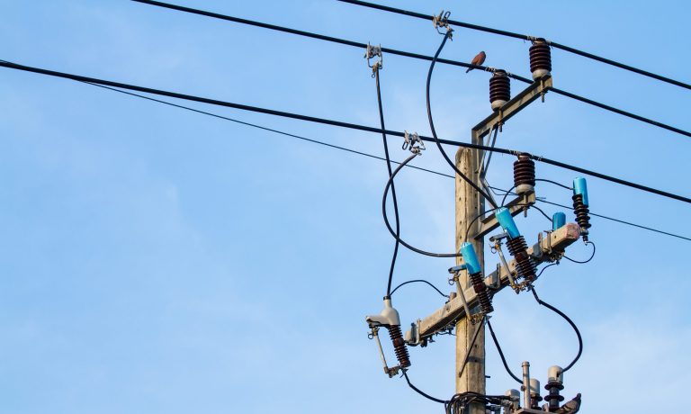electric pole power with blue sky background
