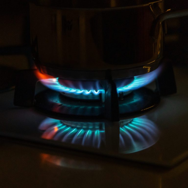 Blue flames of gas burning from a kitchen gas stove