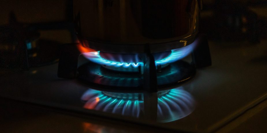 Blue flames of gas burning from a kitchen gas stove
