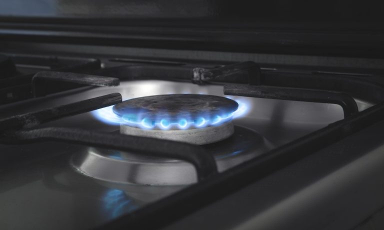 Gas burner with a burning fire. Kitchen gas