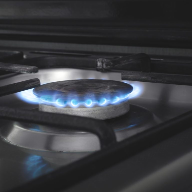 Gas burner with a burning fire. Kitchen gas