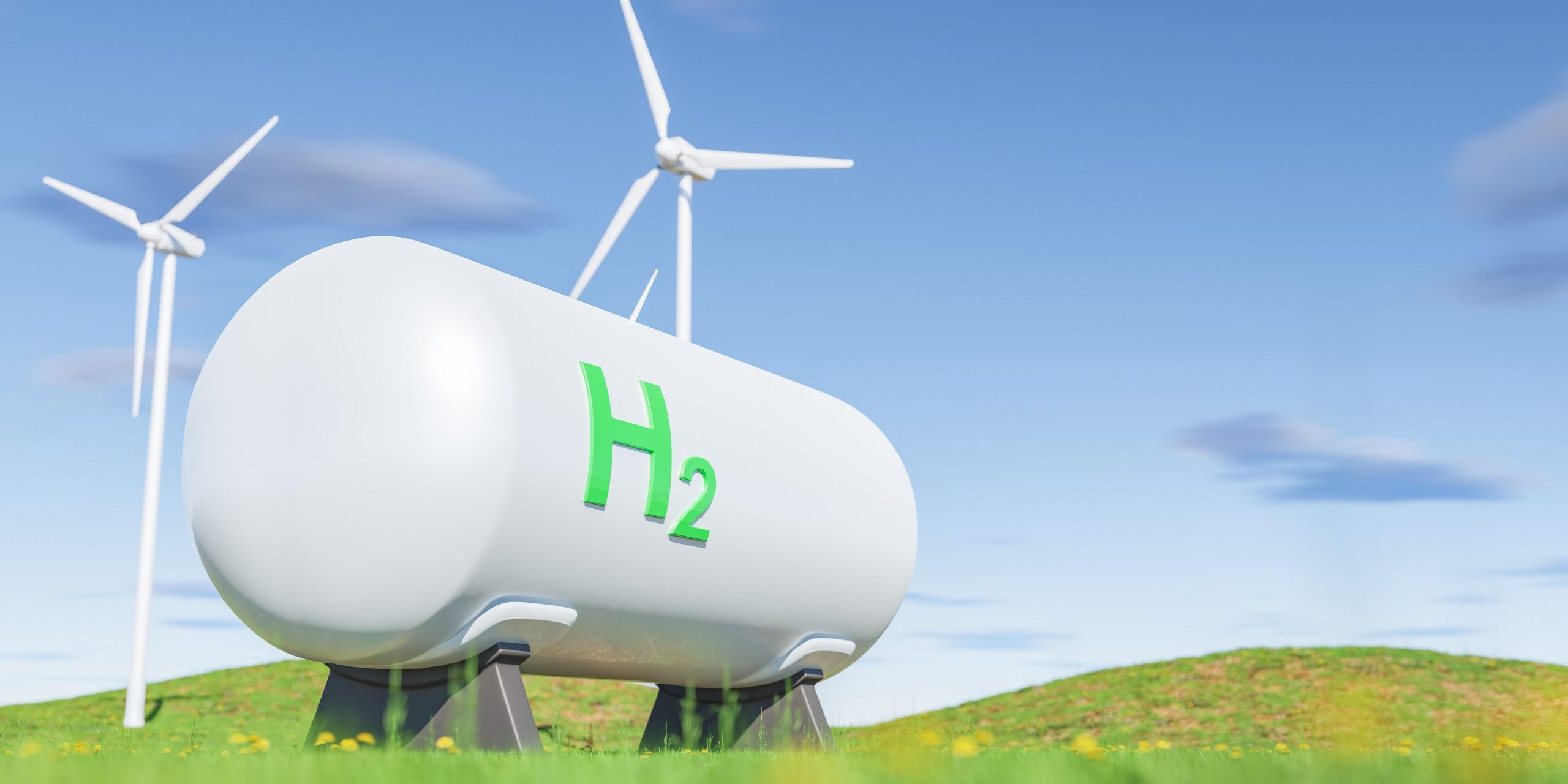 Tanks with gas near wind turbines in green field