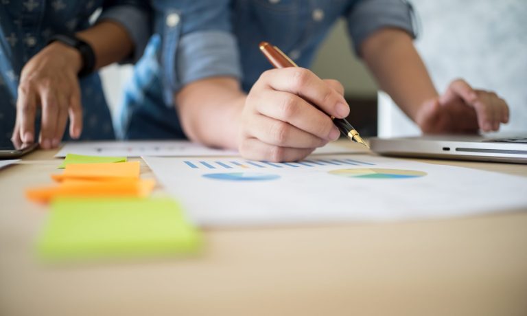 Business team working on a new business plan with modern digital