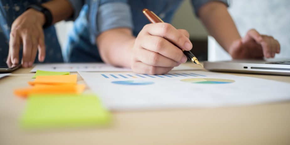 Business team working on a new business plan with modern digital