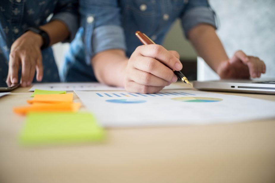 Business team working on a new business plan with modern digital