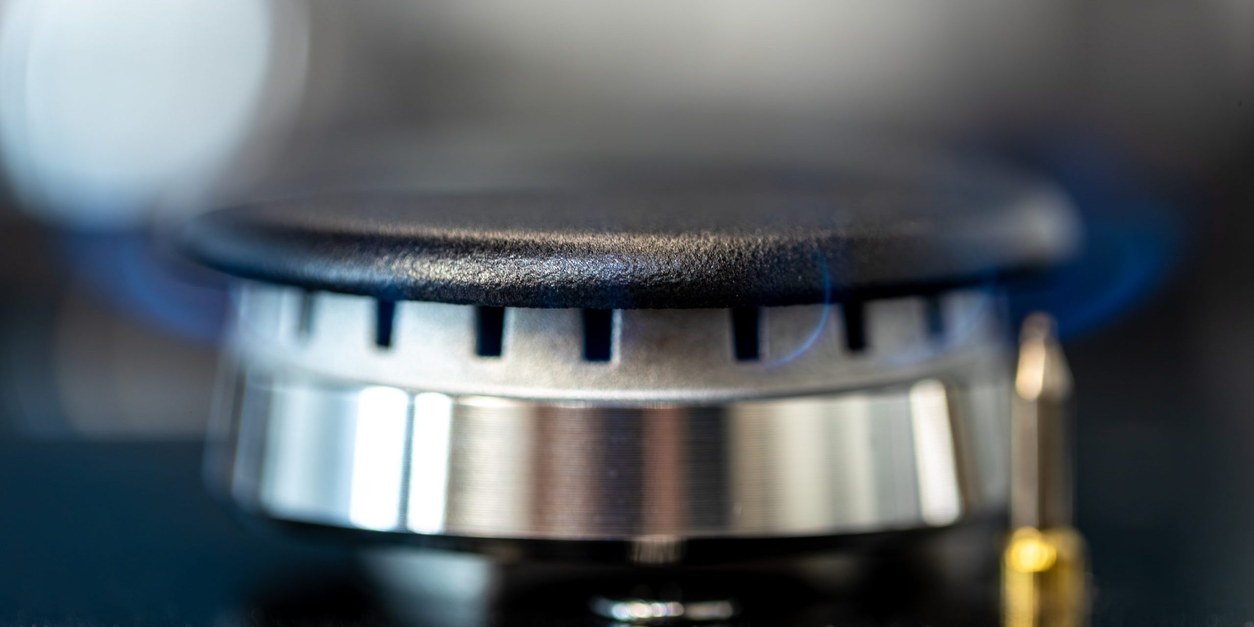 Active gas burner. Steel and flame. Close-up view.