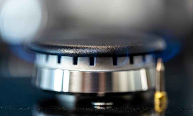 Active gas burner. Steel and flame. Close-up view.