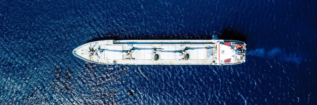 Aerial view of a blue sea and a boat
