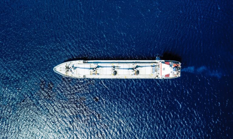 Aerial view of a blue sea and a boat