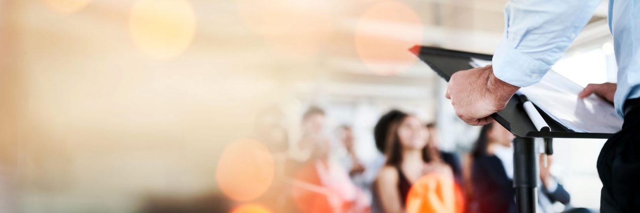 podium-business-presentation-speaker-audience-conference-banner-with-mockup-space-corporate-training-people-seminar-communication-leadership-public-speaking-with-bokeh